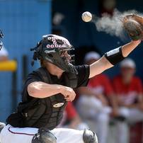 The ball sails above the mit of Milan High School catcher, junior Jacob Friese during the first inning of the MHSAA baseball quarterfinals against Coldwater High School at Nichols Field at Bailey Park in Battle Creek on Tuesday, June 11, 2013. Melanie Maxwell | AnnArbor.com